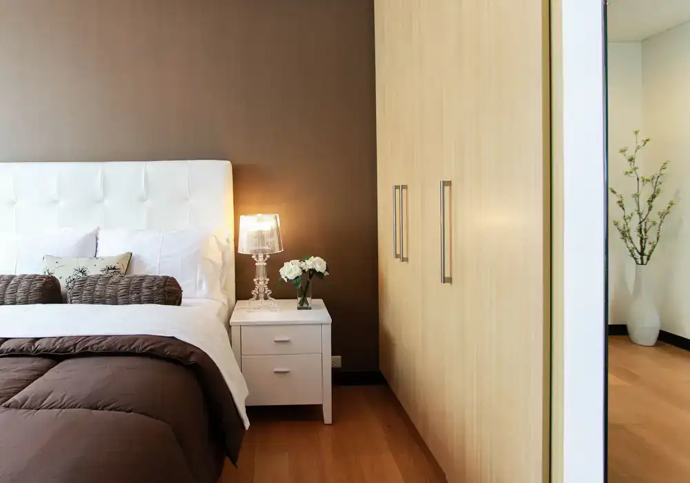 Bedroom furniture collection featuring wooden beds and large wardrobes
